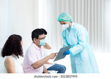 Diverse People Line Up Sit And Wait In Line To Get Vaccinated. Female Doctor Asks Information On Vaccination Patients Hospital Young People And Elderly People Queue For Vaccination Against Coronavirus