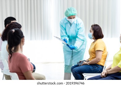 Diverse People Line Up Sit And Wait In Line To Get Vaccinated. Female Doctor Asks Information On Vaccination Patients Hospital Young People And Elderly People Queue For Vaccination Against Coronavirus