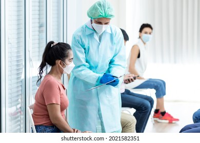 Diverse People Line Up Sit And Wait In Line To Get Vaccinated. Female Doctor Asks Information On Vaccination Patients Hospital Young People And Elderly People Queue For Vaccination Against Coronavirus