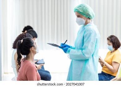 Diverse People Line Up Sit And Wait In Line To Get Vaccinated. Female Doctor Asks Information On Vaccination Patients Hospital Young People And Elderly People Queue For Vaccination Against Coronavirus