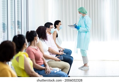 Diverse People Lining Up Waiting Sit For Their Turn To Get Shots At The Hospital Vaccination Center. Young Men And Women, Senior Citizens Standing In Queue For Antiviral Covid-19 Or Flu Vaccine Corona