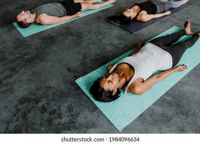 Diverse People In A Savasana Pose