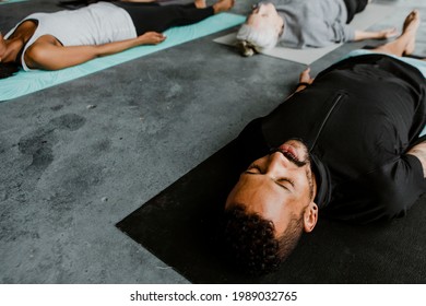 Diverse People In A Savasana Pose