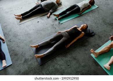 Diverse People In A Savasana Pose