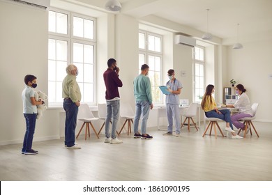 Diverse People Standing In Line At The Hospital During Vaccination Campaign. Young Men And Women, Senior Citizens And Children Waiting For Their Turn To Get Modern Antiviral Covid-19 Or Flu Vaccine