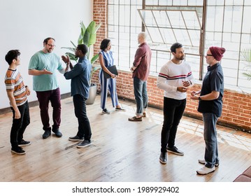 Diverse People Talking In Groups During A Break