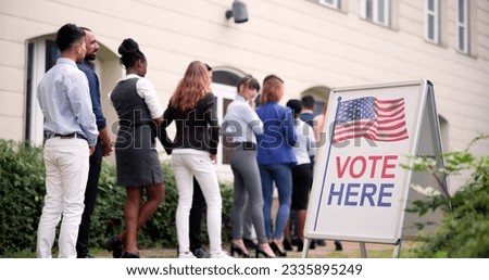 Diverse People At Voting Booth. Vote Here Elections Sign