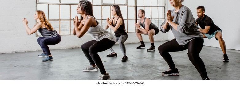 Diverse people in a yoga class - Powered by Shutterstock