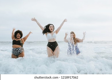 Diverse plus size women having fun in the water