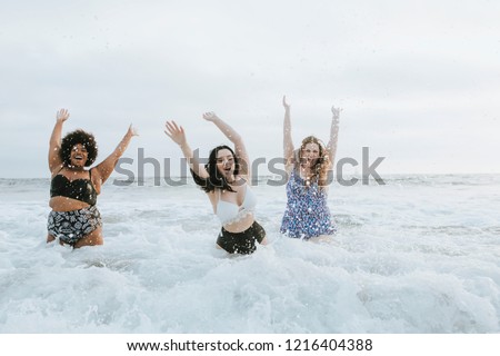 Diverse plus size women having fun in the water