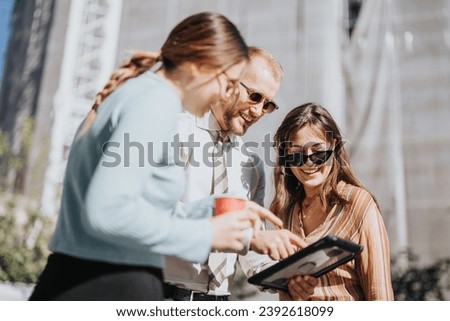 Similar – Multiethnic friends resting outside food truck in evening