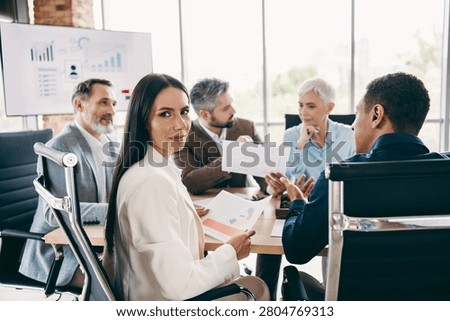 Diverse professionals engaged in teamwork, presenting proposals and analyzing data, showcasing collaboration and strategic thinking in a bright office.