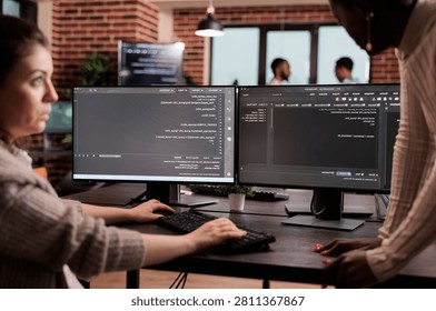 Diverse programming engineers developing html code and cloud computing in it development agency, Software developer working on database programming with html script, computing big data.