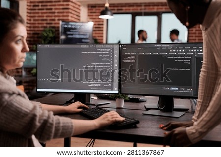 Diverse programming engineers developing html code and cloud computing in it development agency, Software developer working on database programming with html script, computing big data.