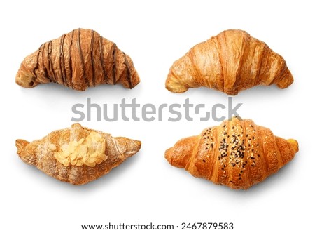 Diverse range of croissants with flaky textures and delectable toppings to tantalize your taste buds isolated on white background. Top view