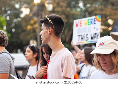 Diverse Real People Walking At Pride Parade With Rainbow Flag As Symbol Of Pride Month. Queer Community March In The Street With Crowds. LGBTQIA March, Inclusivity: VALENCIA, SPAIN - JUNE 25 2022