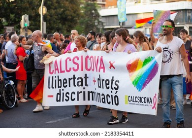 Diverse Real People Walking At Pride Parade With Rainbow Flag As Symbol Of Pride Month. Queer Community March In The Street With Crowds. LGBTQIA March, Inclusivity: VALENCIA, SPAIN - JUNE 25 2022