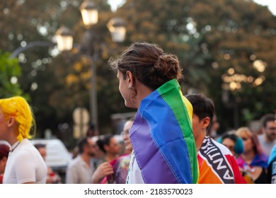 Diverse Real People Walking At Pride Parade With Rainbow Flag As Symbol Of Pride Month. Queer Community March In The Street With Crowds. LGBTQIA March, Inclusivity: VALENCIA, SPAIN - JUNE 25 2022