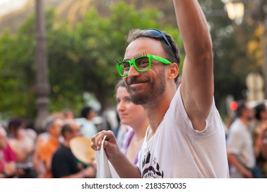 Diverse Real People Walking At Pride Parade With Rainbow Flag As Symbol Of Pride Month. Queer Community March In The Street With Crowds. LGBTQIA March, Inclusivity: VALENCIA, SPAIN - JUNE 25 2022