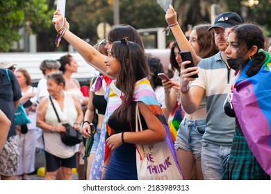 Diverse Real People Walking At Pride Parade With Rainbow Flag As Symbol Of Pride Month. Queer Community March In The Street With Crowds. LGBTQIA March, Inclusivity: VALENCIA, SPAIN - JUNE 25 2022