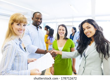 Diverse Smiling People Shaking Hands