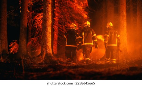 Diverse Squad of Male and Female Firefighters Trail Deep in a Forest to Stop a Wildland Fire from Spreading. Superintendent Giving Orders and Instructions on Where to Move to Extinguish the Fire. - Shutterstock ID 2258645665