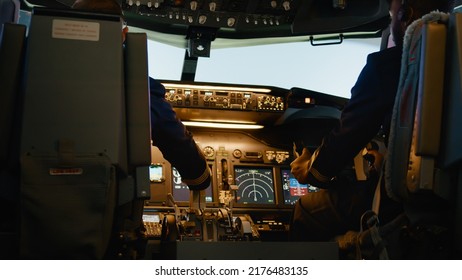 Diverse Team Of Aviators Throttling Engine Lever To Takeoff, Using Handle And Dashboard Command To Fly Airplane. Control Panel Navigation With Power Switch In Cockpit.