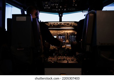 Diverse Team Of Captain And Pilot Pushing Engine Throttle Lever To Takeoff With Airplane From Aviation Cockpit. Aircrew Men Flying Plane Jet Using Dashboard And Control Panel Command.