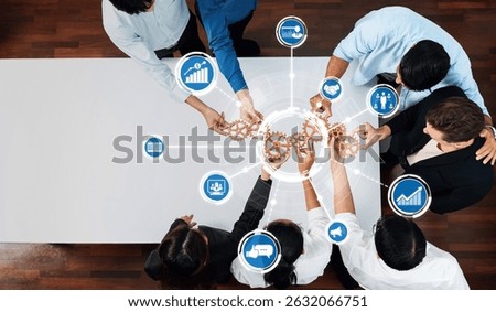 A diverse team collaborates over a table, using creative gears to symbolize strategic planning and teamwork. This image captures the essence of effective business development. Amity