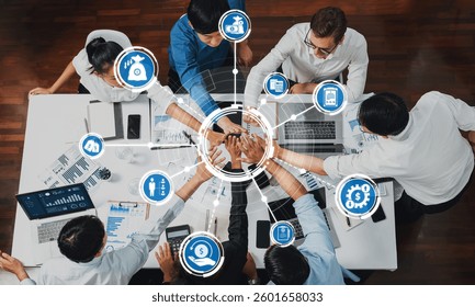 A diverse team collaborates in a strategic meeting, utilizing digital interfaces for project management and financial analysis to enhance productivity and innovation. Amity - Powered by Shutterstock - Get 15% off with code: PIKWIZARD15