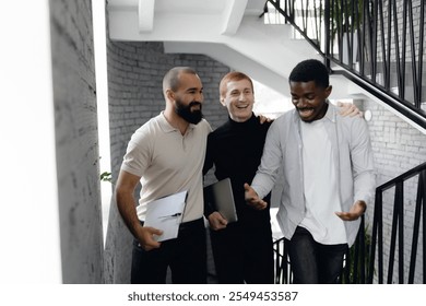 Diverse Team Collaborating on Office Staircase for Business Success and Innovation. - Powered by Shutterstock