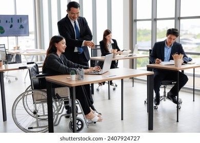 Diverse Team Collaboration: Business Manager Engages in Strategic Discussion with businesswoman in Wheelchair - Powered by Shutterstock