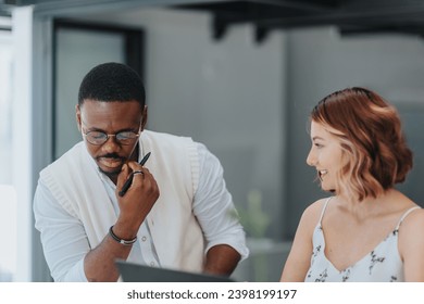 A diverse team of colleagues in a modern office working together on marketing strategies and content creation. They prioritize targeting and data analysis to maximize ROI. - Powered by Shutterstock