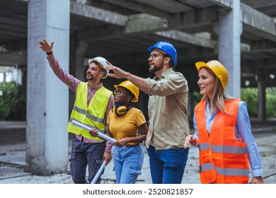 A diverse team of construction professionals wearing safety gear and hard hats, collaborating and reviewing plans at a building site. Teamwork and architecture are highlighted in this dynamic image. - Powered by Shutterstock