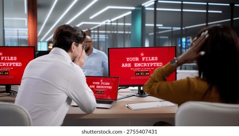 Diverse Team Of Cybersecurity Experts Using Laptops To Stop Ransomware Attacks. Business Professionals