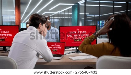 Diverse Team Of Cybersecurity Experts Using Laptops To Stop Ransomware Attacks. Business Professionals