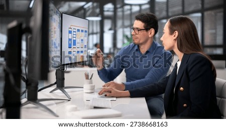 Diverse Team Of Designers Using Computers For UI UX Development. Flight Attendant Providing Training