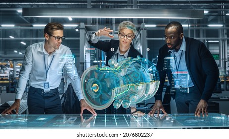 Diverse Team of Engineers Working in Office at Industrial Factory. Industrial Designers Discuss Jet Engine Augmented Reality Hologramm. Specialists Work in Technological Plane Development Facility. - Shutterstock ID 2076802237