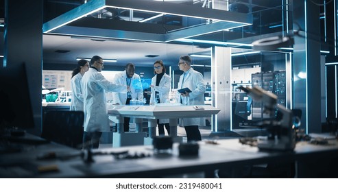 Diverse Team of Green Energy Engineers Using Futuristic Hologram of Wind Turbine Prototype In Computer Powered Laboratory. Multiethnic Colleagues Looking at VFX Projection. High Technology Concept. - Powered by Shutterstock