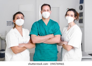 Diverse team of healthcare professionals wearing protective face mask, working at a physical rehabilitation clinic during coronavirus pandemic. High quality photo - Powered by Shutterstock