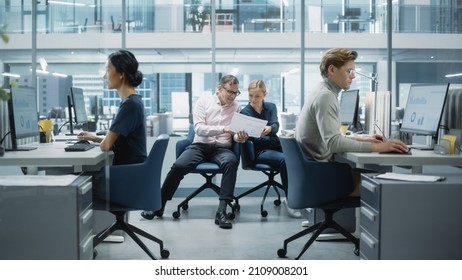 Diverse Team of Managers Working and Having Discussions in Modern Big City Office. Colleagues Work on New Business Opportunities, Evaluate Financial Reports, Plan Investment Strategy.
