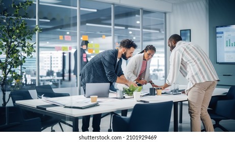 Diverse Team of Professional Businesspeople Meeting in the Office Conference Room. Creative Team Around Table, Black Businesswoman, African-American Digital Entrepreneur and Hispanic CEO Talking.