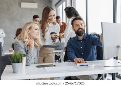 A diverse team of professionals engaging in project discussion within a modern office setting. They appear focused and enthusiastic, fostering a collaborative and innovative work atmosphere. - Powered by Shutterstock