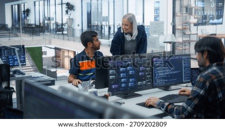 Diverse Team of Software Developers Collaborating in a Modern Office. Male and Female Programmers Discussing Code, Enhancing Productivity and Innovation Through Teamwork and Advanced Technology.