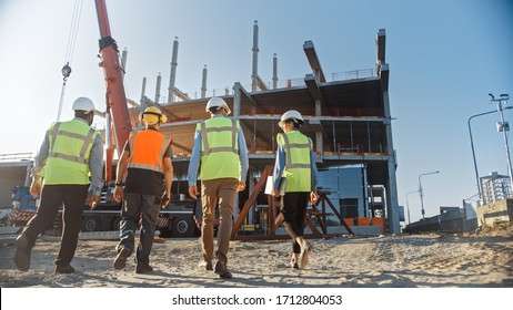 Diverse Team of Specialists Inspect Commercial, Industrial Building Construction Site. Real Estate Project with Civil Engineer, Investor and Businesswoman. In the Background Skyscraper Formwork Frames - Shutterstock ID 1712804053