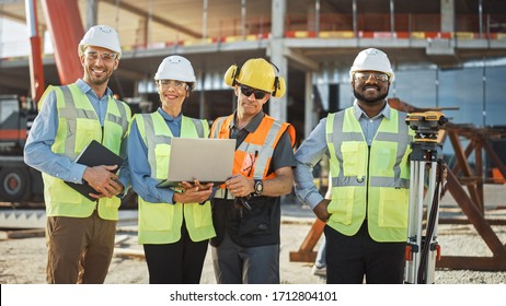 Diverse Team of Specialists Use Laptop Computer on Construction Site. Real Estate Building Project with Machinery: Civil Engineer, Investor, Businesswoman and Builder Discussing Blueprint Plan