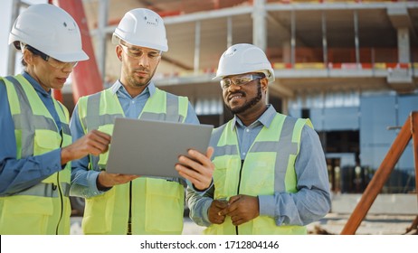 Diverse Team of Specialists Use Laptop on Construction Site. Real Estate Building Project with Engineer Investor and Businesswoman Checking Area, working on Civil Engineering, Discussing Strategy Plan