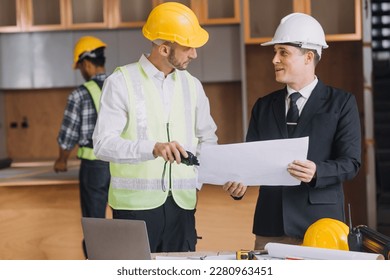 Diverse Team of Specialists Use Tablet Computer on Construction Site. Real Estate Building Project with Civil Engineer, Architect, Business Investor and General Worker Discussing Plan Details. - Powered by Shutterstock