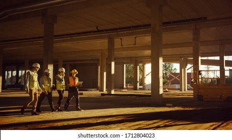 Diverse Team of Specialists Walk Through Garage Level of Industrial / Commercial Building Construction Site. Real Estate Project with Civil Engineer, Investor and Worker. Skyscraper Formwork Frames