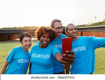 Diverse volunteers taking a selfie together - Shutterstock ID 1866357415